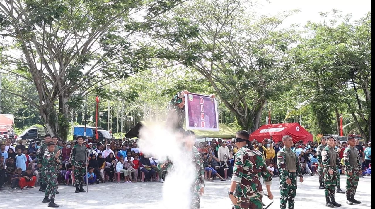 Dirgahayu Kabupaten Keerom ke-21, Personel Satgas Yonif 122/TS Tampilkan Kemampuan Prajurit Dengan Bhakti Sosial Dan Sosialisasi Rekrutmen TNI