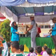 Polsek Kuantan Hilir Gelar Gerak Jalan Santai dalam Rangka HUT RI ke-79 di Kuantan Hilir Seberang
