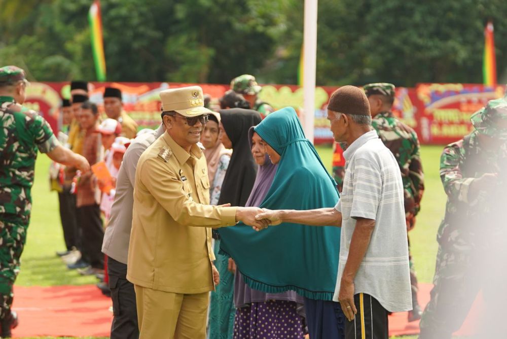 Pj Gubri Hadiri Upacara Penutupan TMMD ke-121 TA 2024 di Kampar